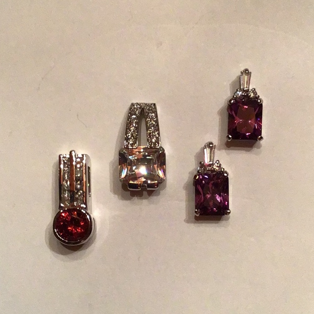 New Set of 4 Silvertone Pendants. Clear CZ accents, rhodium plated, no chain